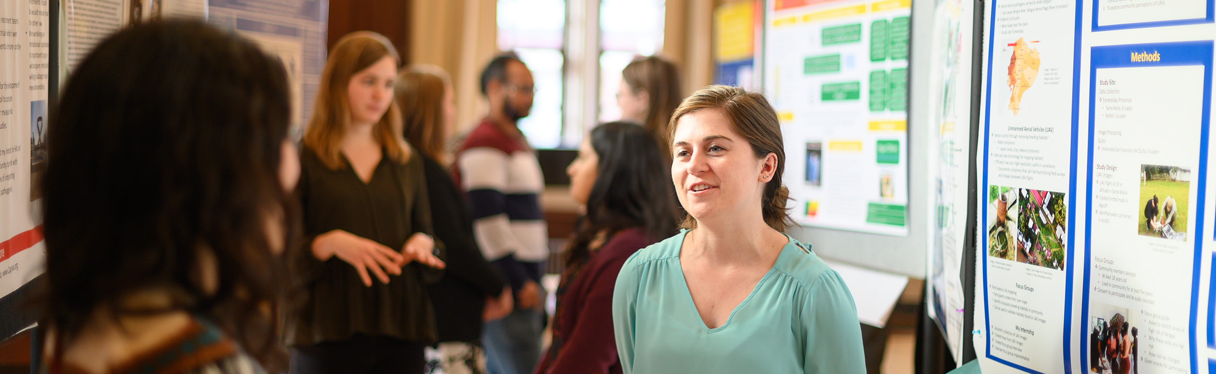Students interacting at a poster session