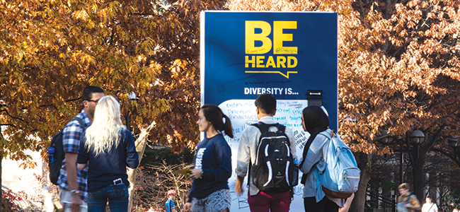students chatting on the UM campus