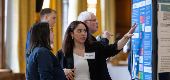 Maysa Hasbrouck presenting a research poster