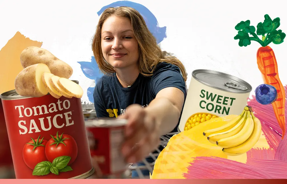 Caroline Paris reaches for cans of vegetables.