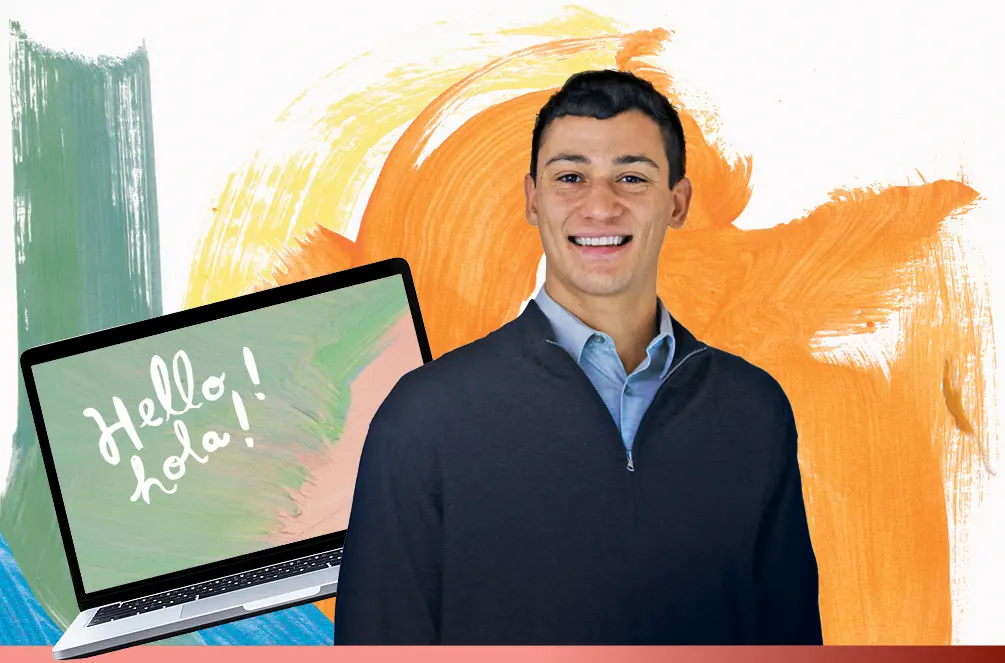 Eduardo Mendez in front of a computer screen that reads Hello! and hola!