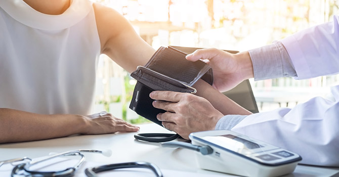 Woman getting blood pressure taken