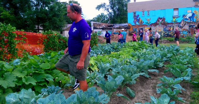 Flint residents work in a community garden