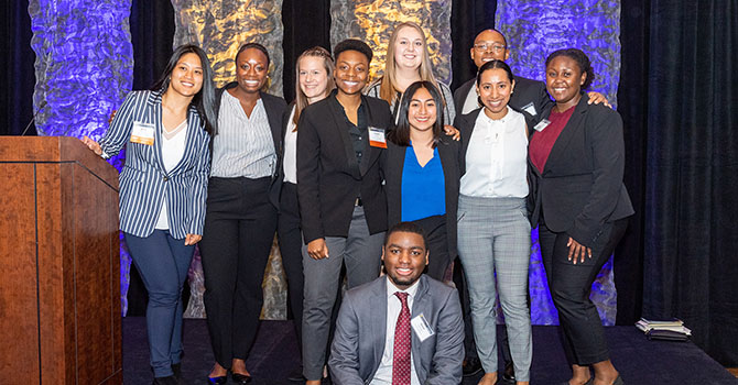 Summer Enrichment Program and Michigan Public Health students and alumni assemble for a group photo at the GLC Symposium.