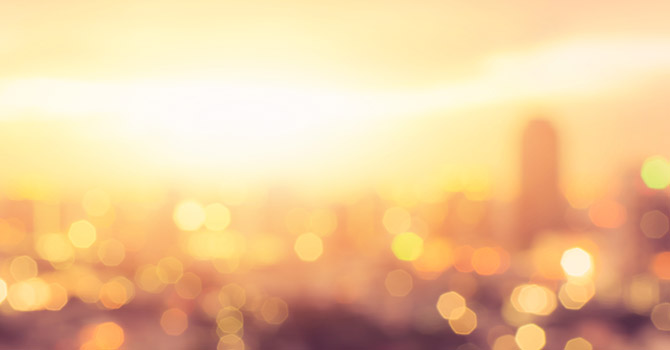 City during heatwave with sun spots in photo.