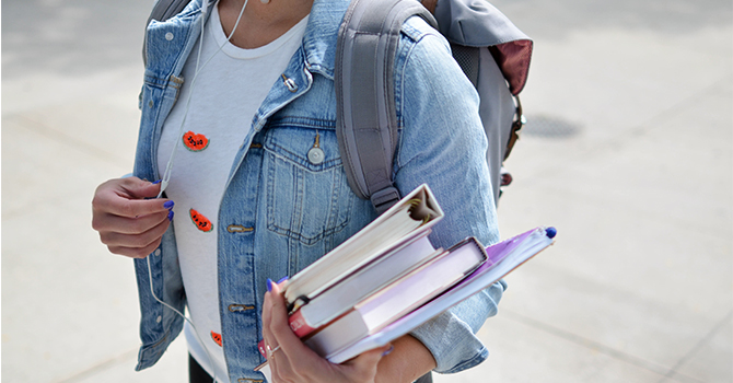 college student carrying books