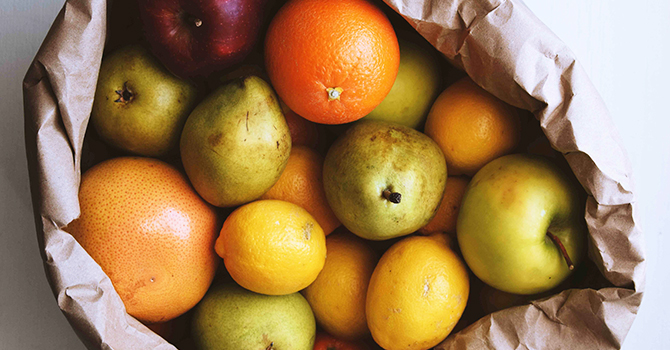 Fiber rich fruits in a brown paper bag