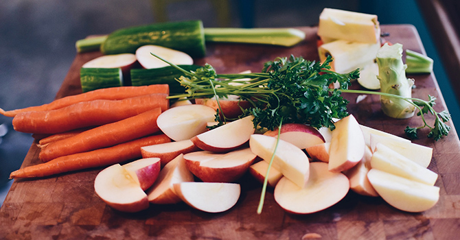 fruits and vegetables on a cutting board