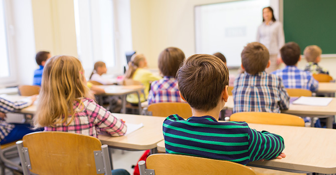 children sitting in classroom