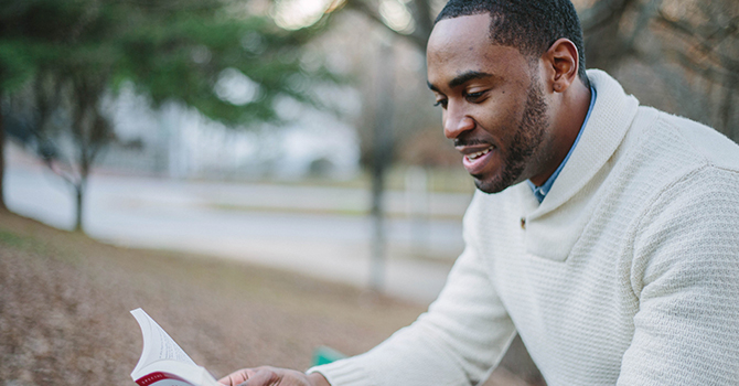 man reading book