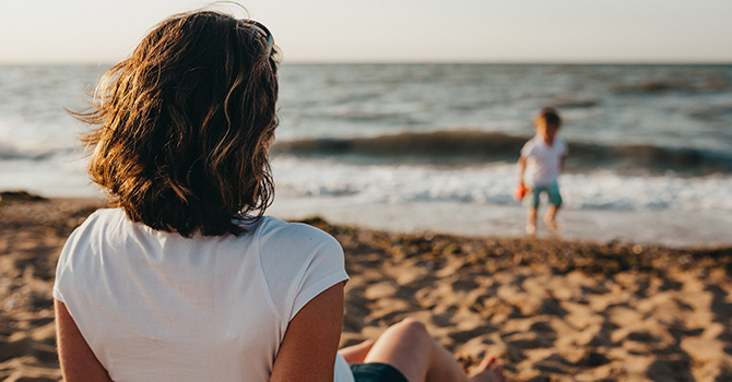 mother and child relaxing at the beach