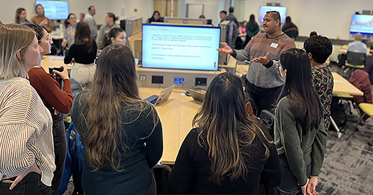 Student giving a presentation in front of peers