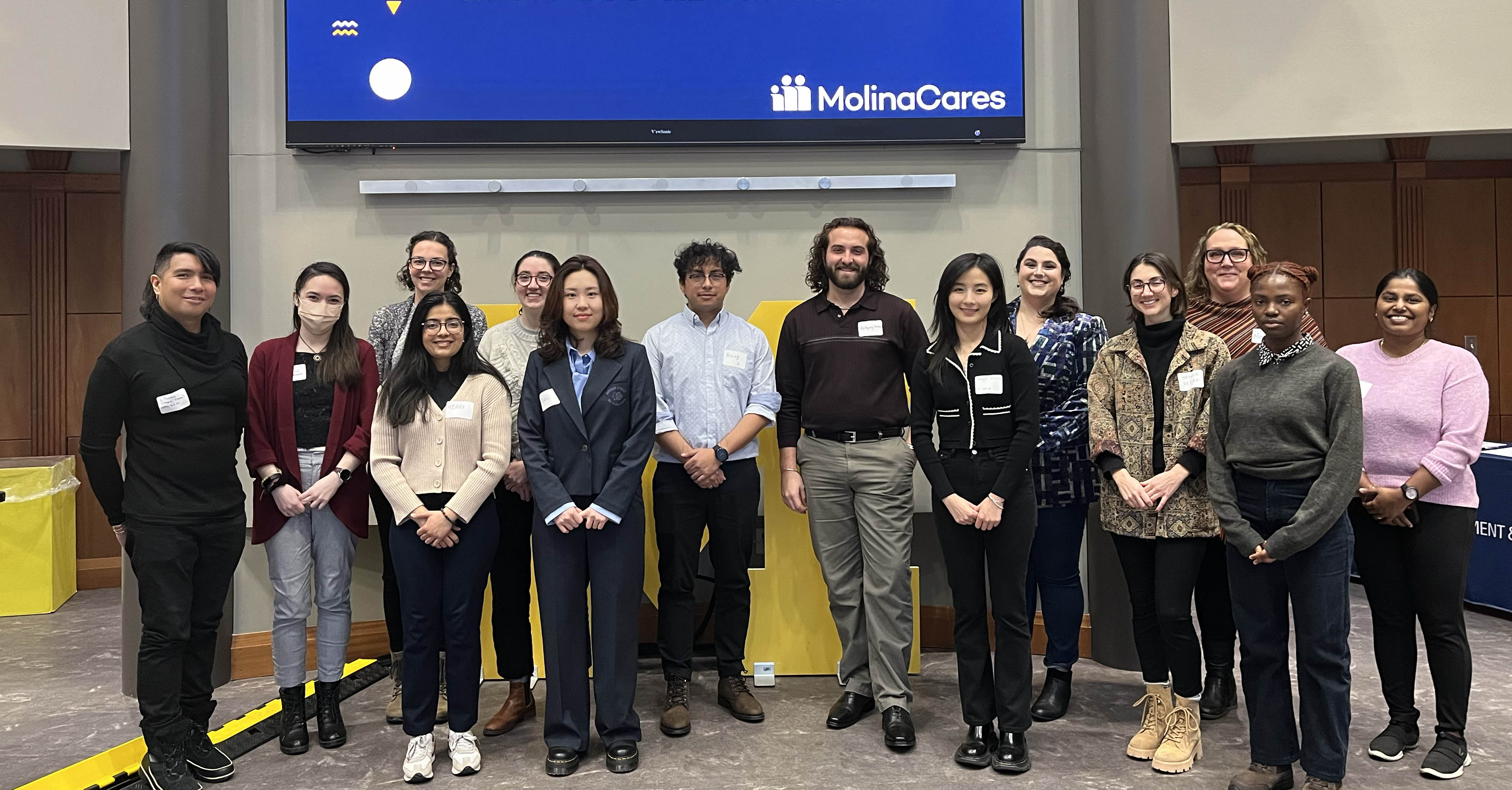 Finalists for the Michigan Health Equity Challenge pose for a group photo in the Paul B. Cornely Room at the University of Michigan School of Public Health.