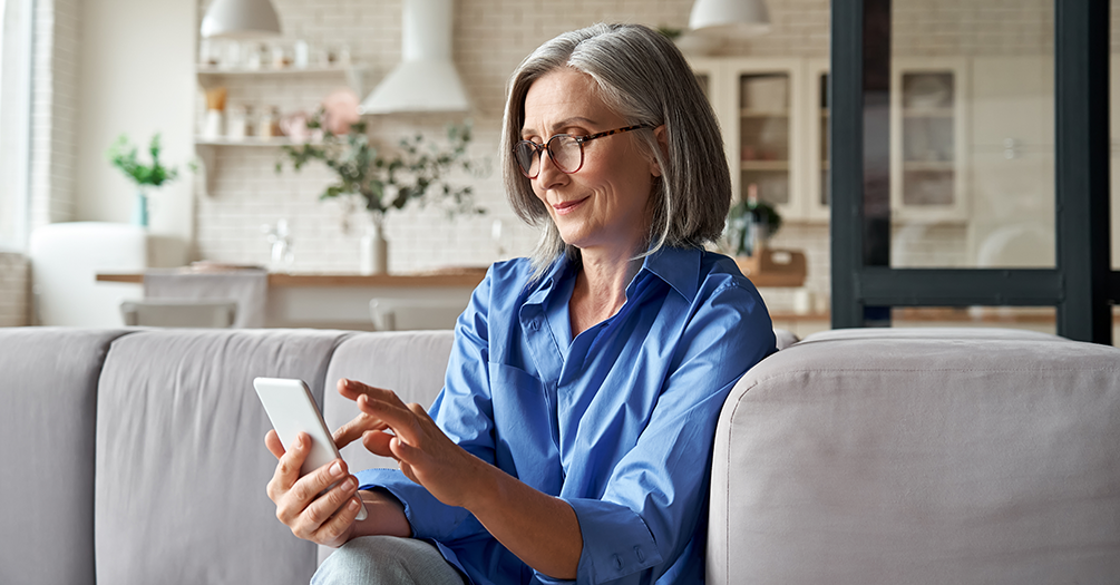 Senior citizen using phone