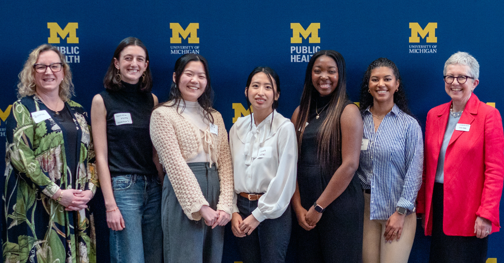 (Left to right) Terrisca Des Jardins, Giuliana Motta, Emily Lin, Sarah Canlas, Nia Ahart, Zoey Humes, and Cathy Killaly pose for a photo during the Michigan Health Equity Challenge reception on April 18, 2025.