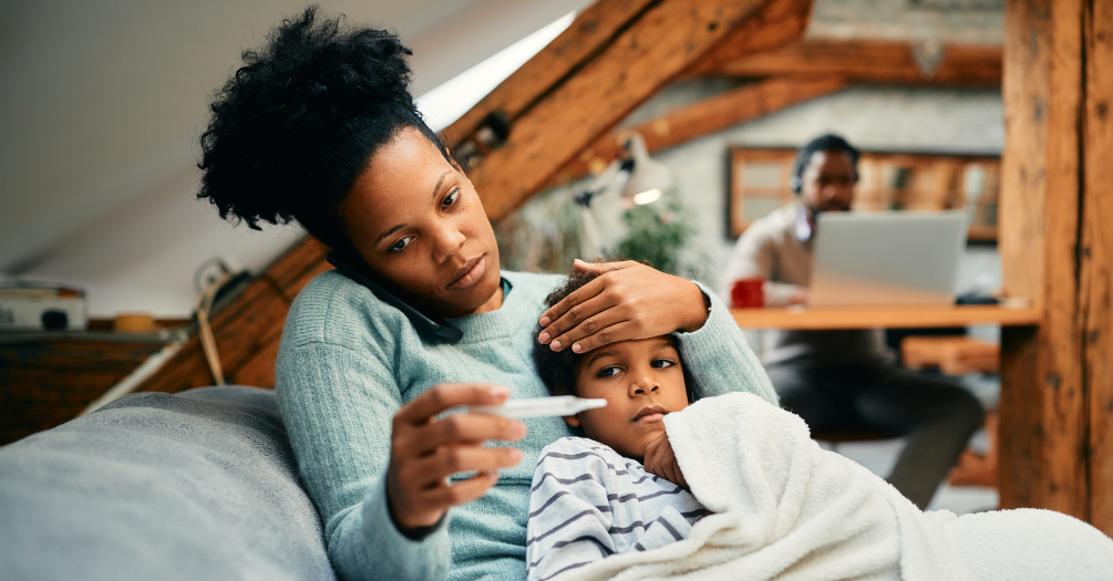 Family tests young child for flu symptoms