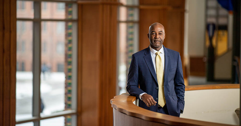 F. DuBois Bowman stands on the second floor balcony of the University of Michigan School of Public Health.