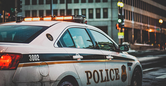 A police car in a city.
