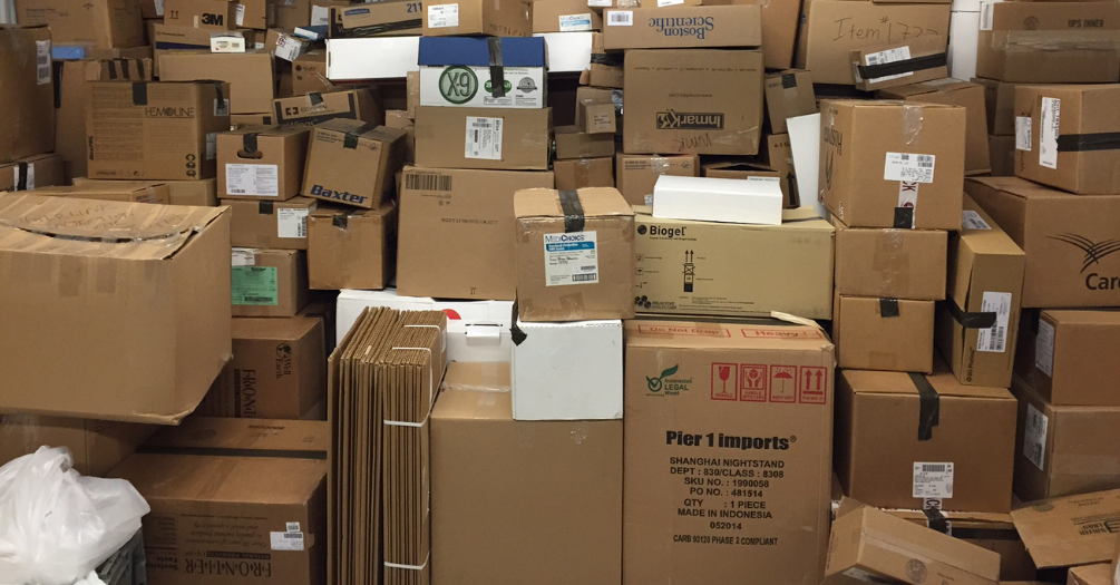 The Blueprints for Pangaea warehouse holds rows and rows of cardboard boxes stacked five and six boxes tall.