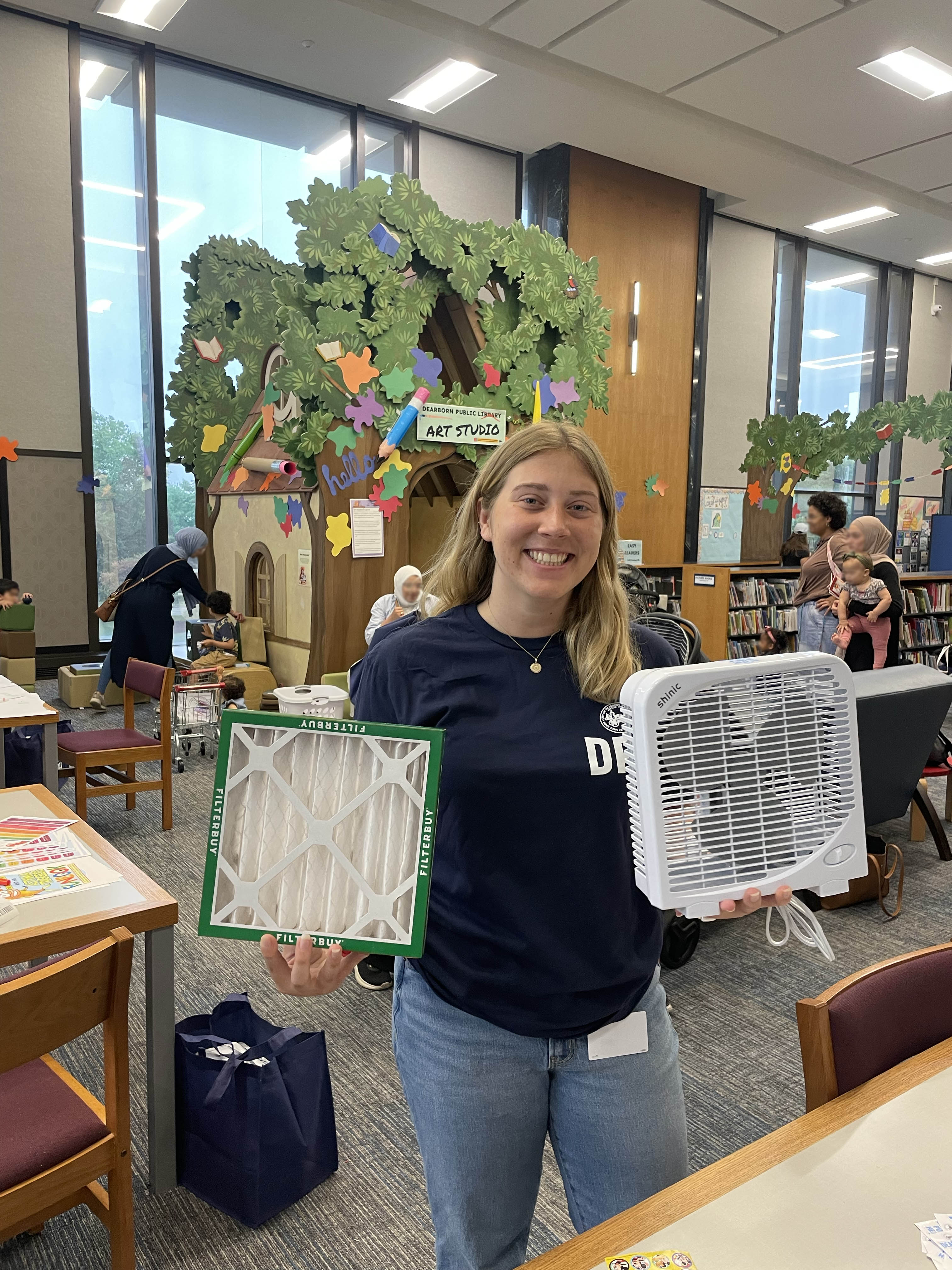 Julia Ginter-Berriman shows the box fan air filters during the Henry Ford Centennial Library event.