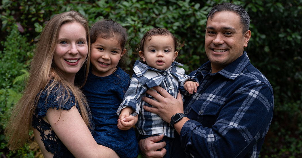 From left, Katie Romas, holding their daughter and her husband, AJ Pope, holding their son